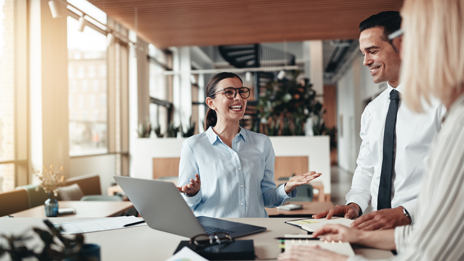 Three people working happily